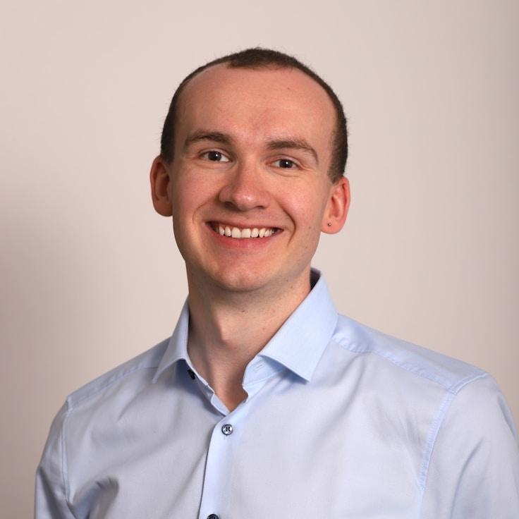 Kaveri Mehta, Lead Design Curator at Soft Line Craft, reviewing corporate floral arrangements